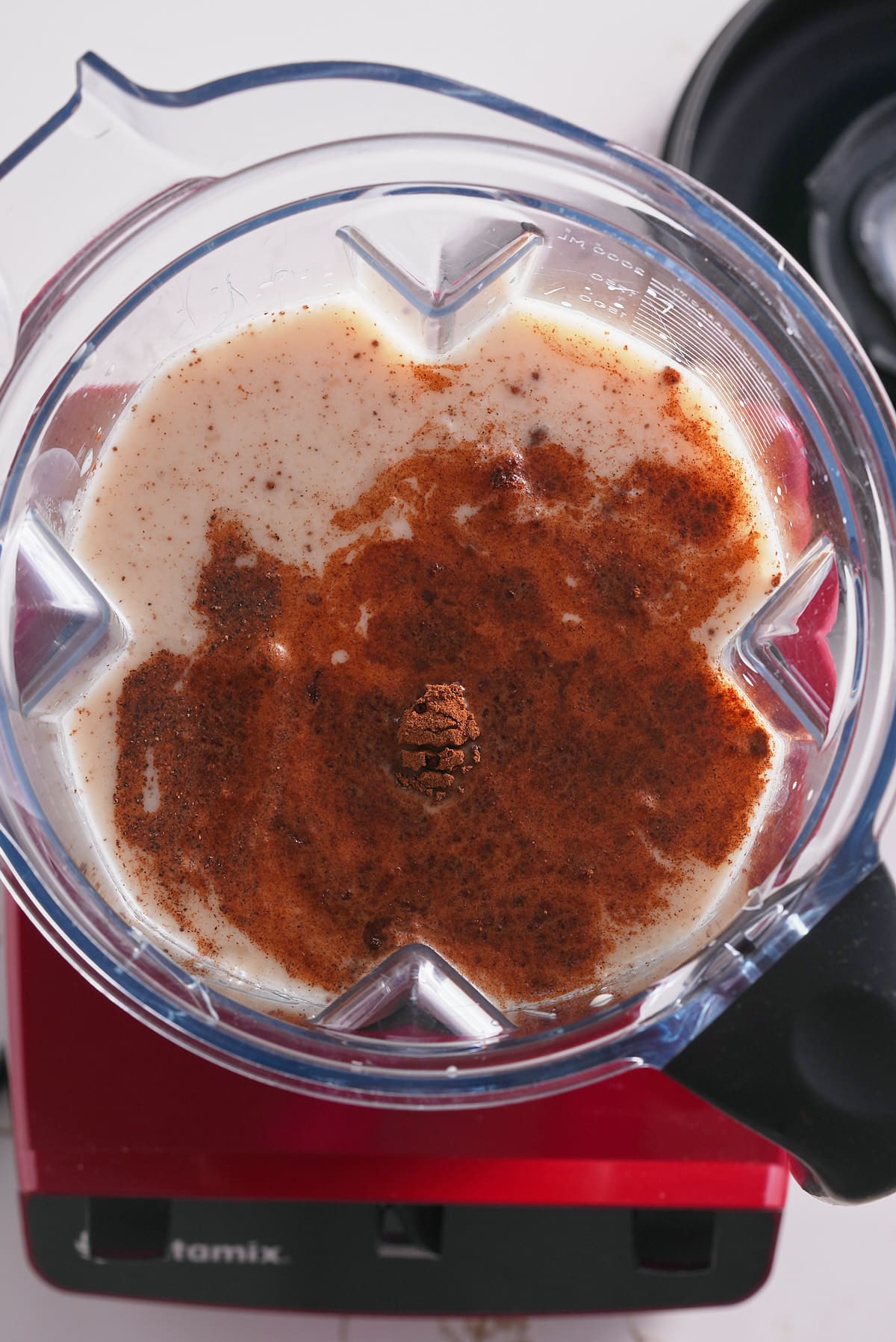 All ingredients are added to the blender for the coquito.