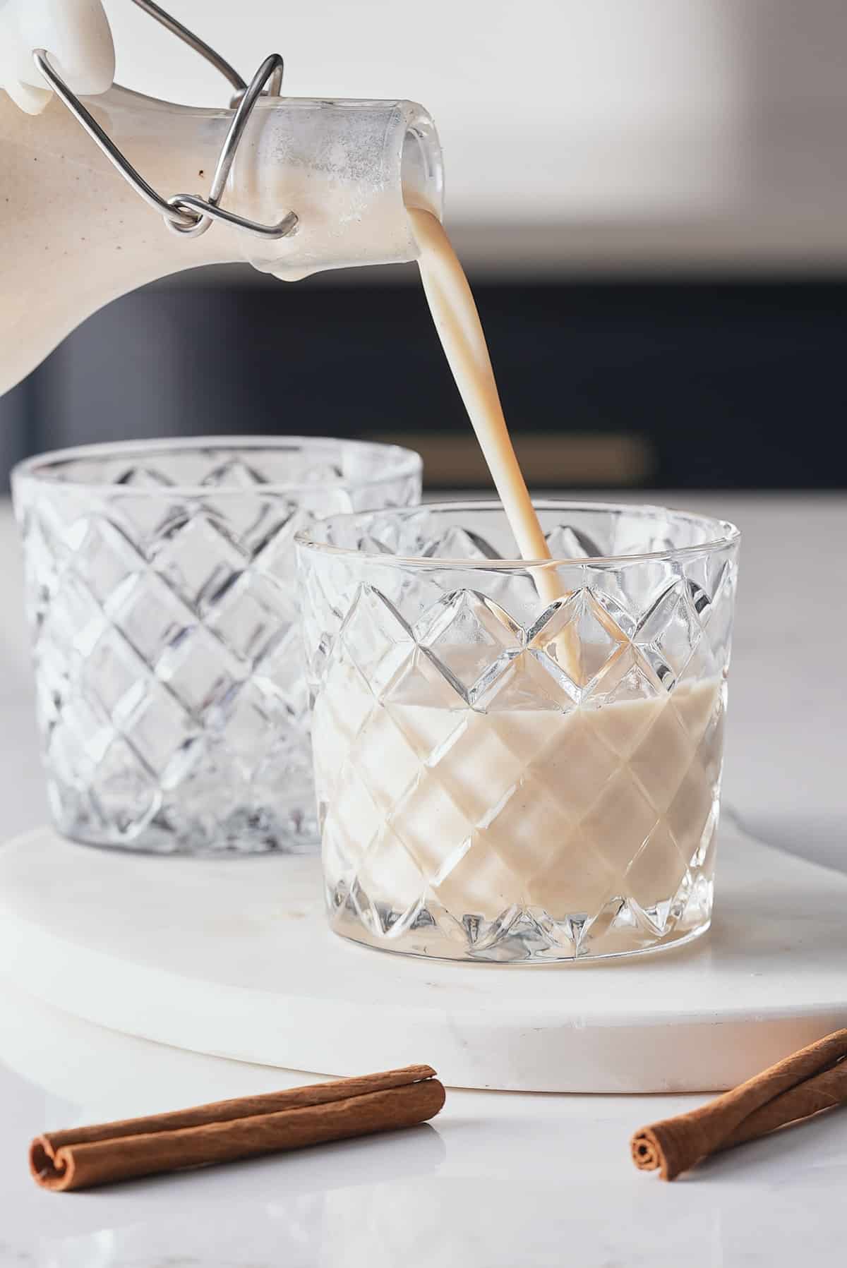 coquito being poured into glass