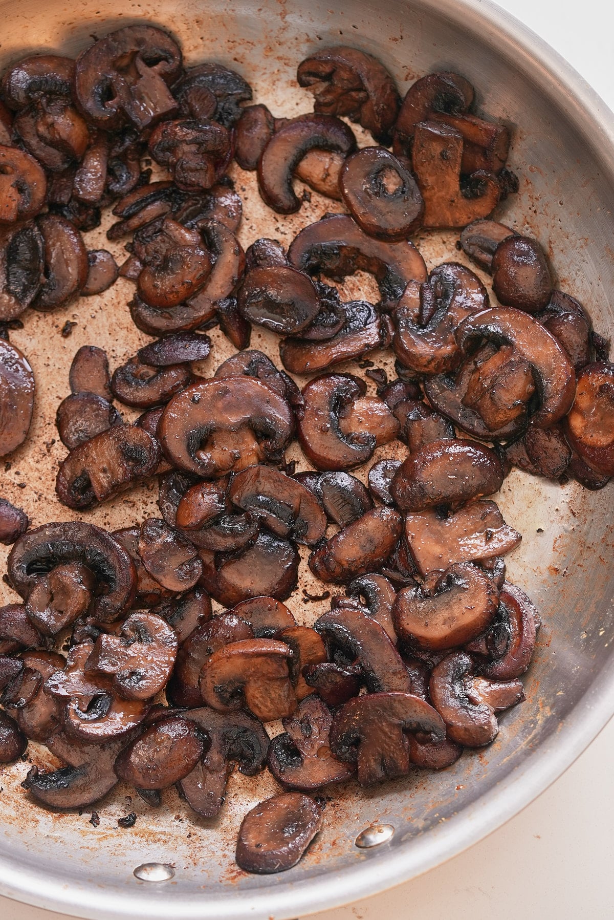 Sauteed mushrooms in a pan.