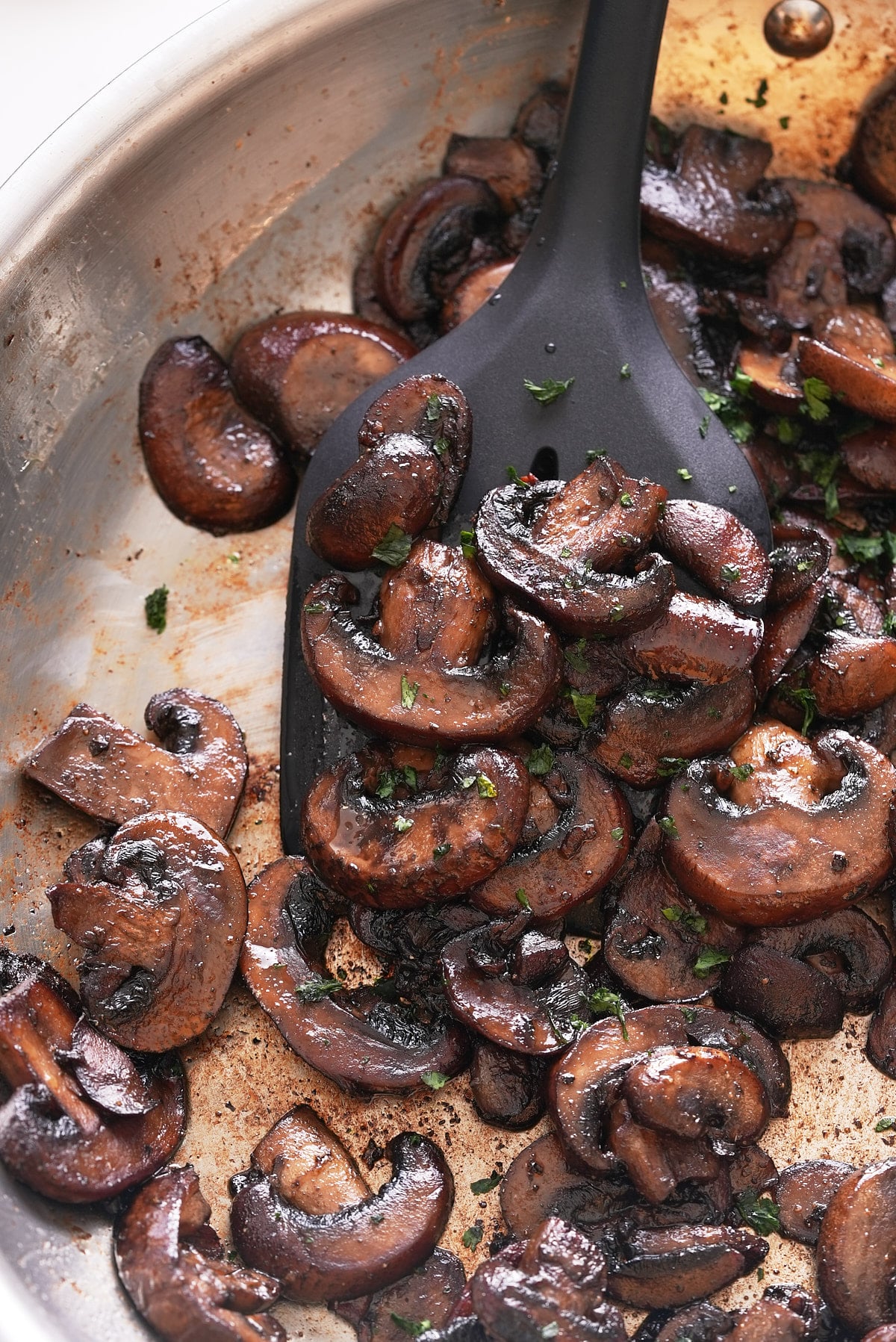 Sauteed mushrooms in a pan.