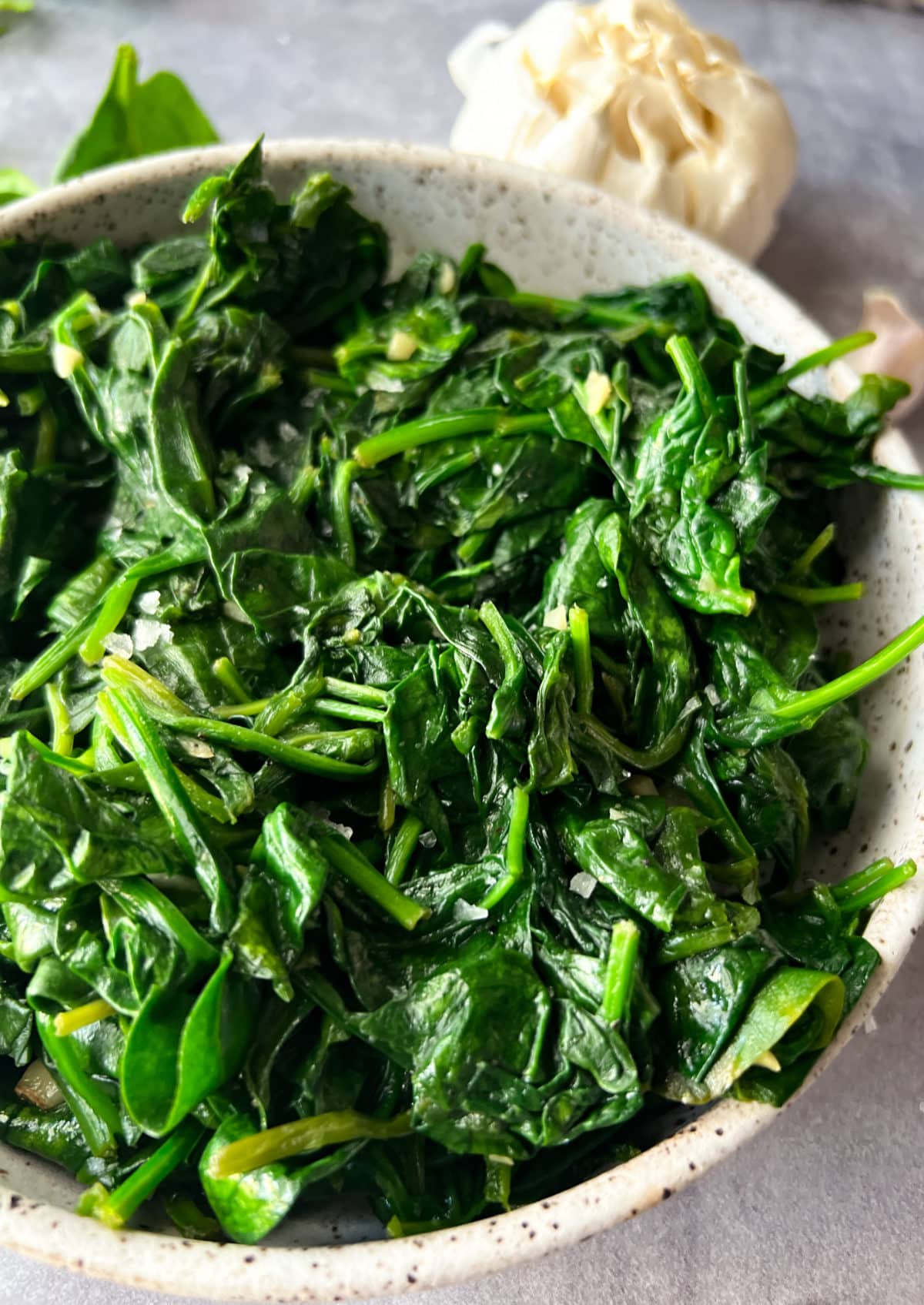 close up side view of sauteed spinach