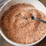 A bowl filled with steak seasoning.