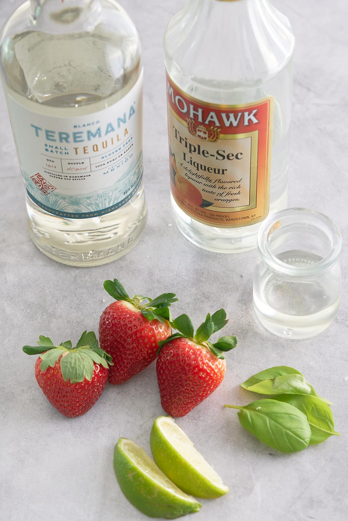 The recipe ingredients for a strawberry basil margarita.