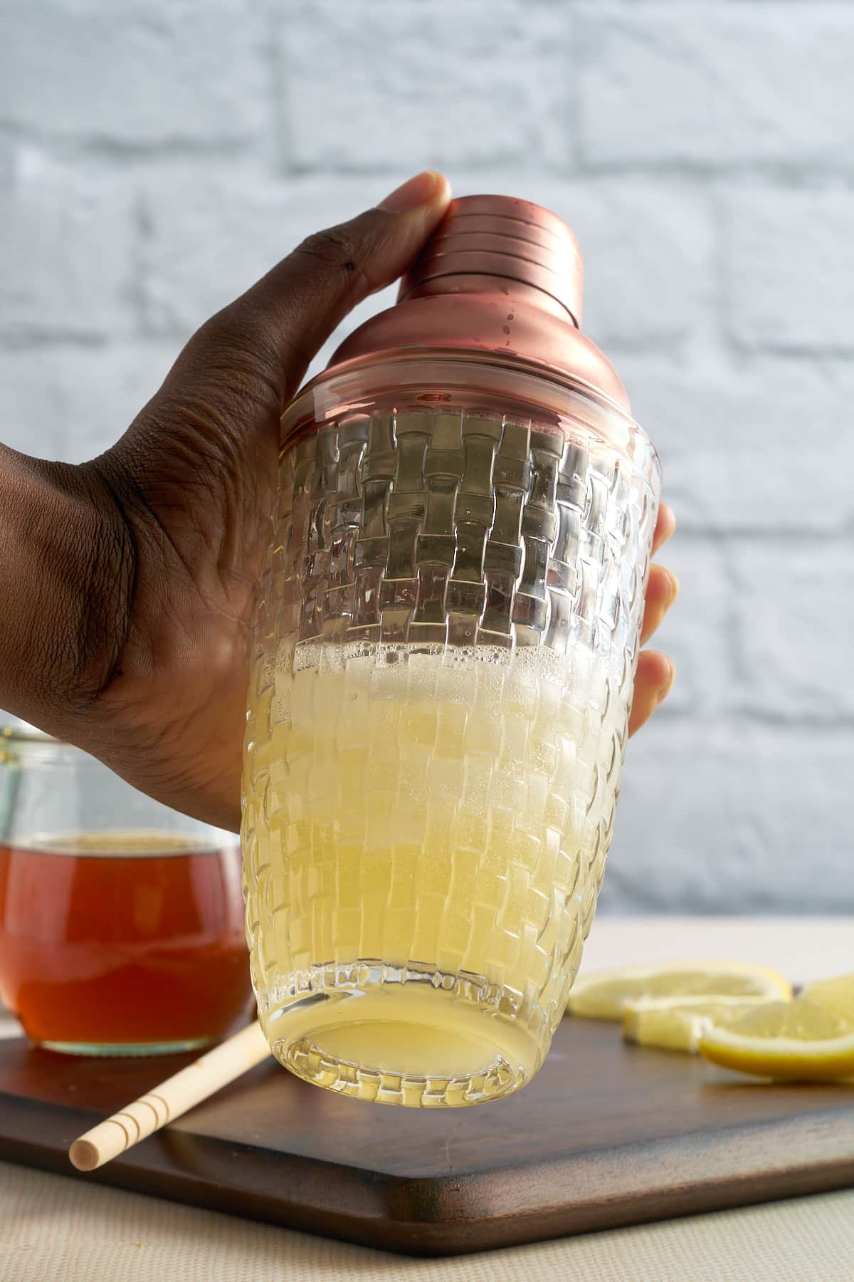 hand shaking the shaker for the cocktail