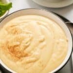 cornmeal porridge in bowl with spoon on side