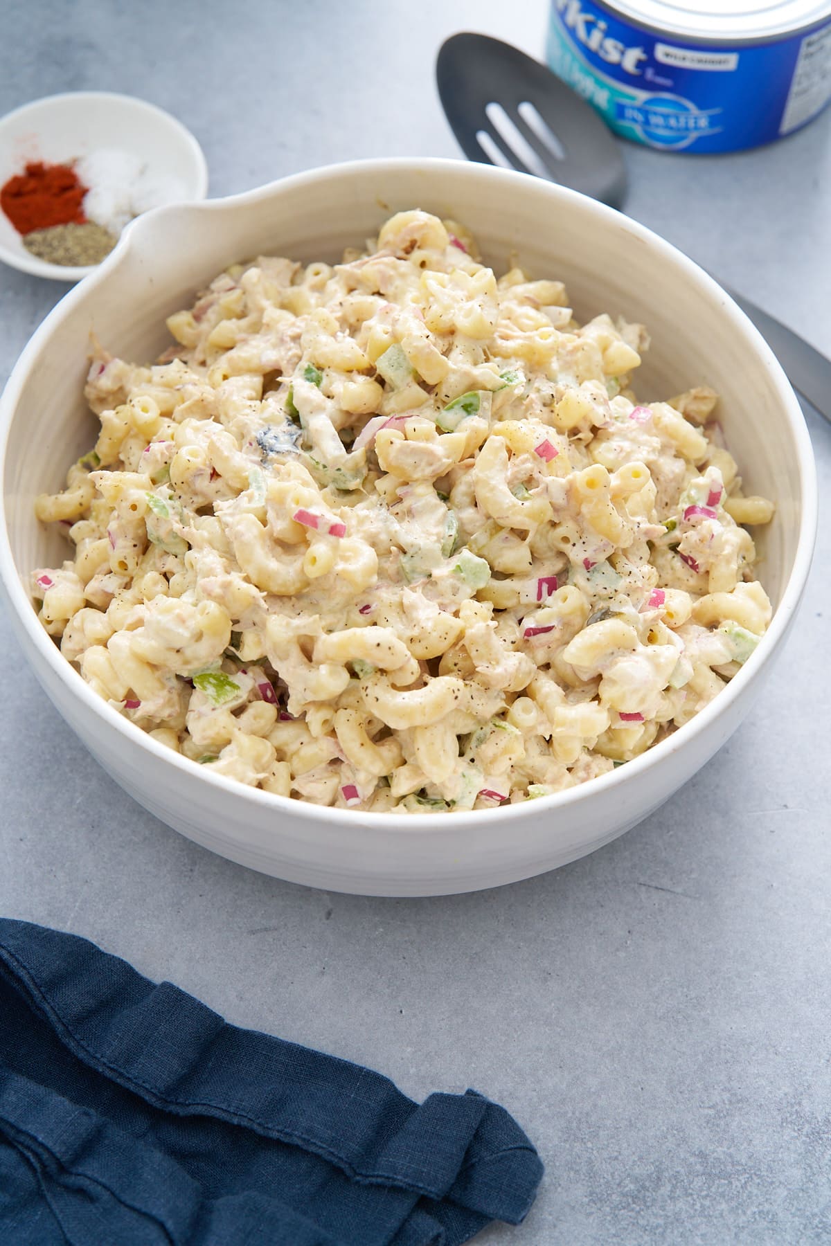 tuna pasta salad in bowl with can of tuna in background