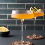 between the sheets cocktails in coup glasses with lemon peel garnish