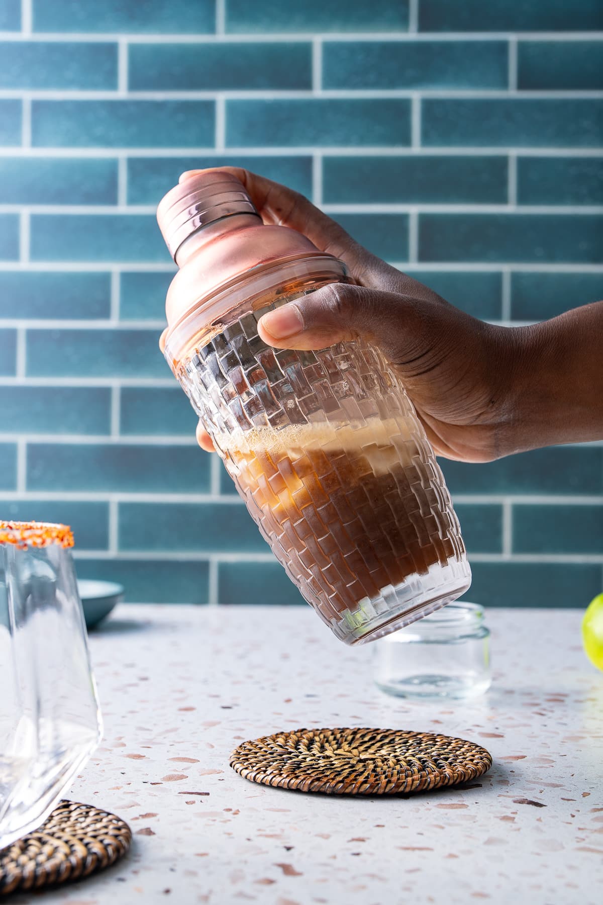 shaking ingredients in margarita shaker