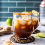 tamarind margarita on coaster with tamarind pod on table