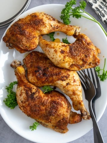 baked chicken leg quarters on plate