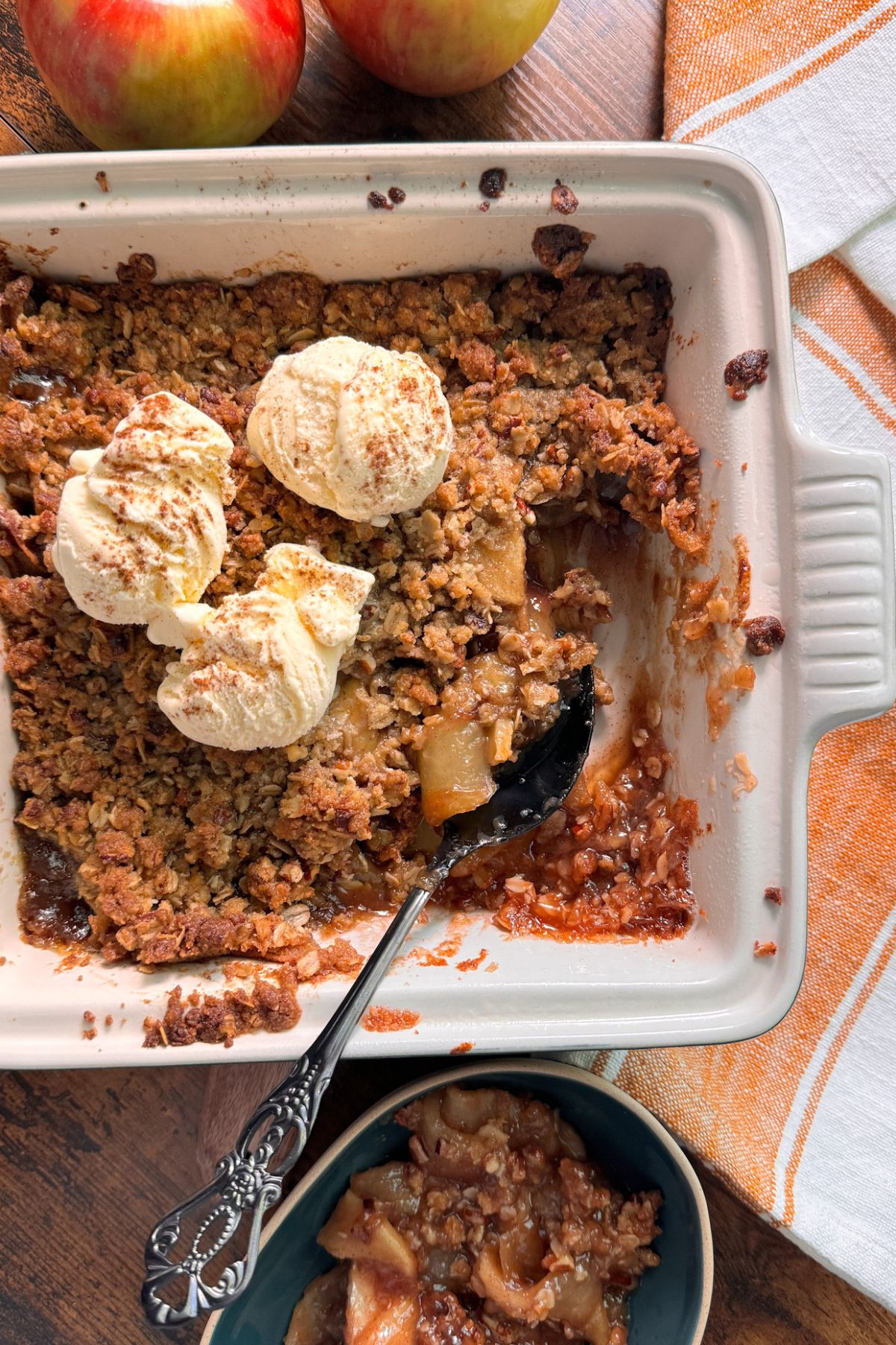 apple crisp with spoon spooning out sone