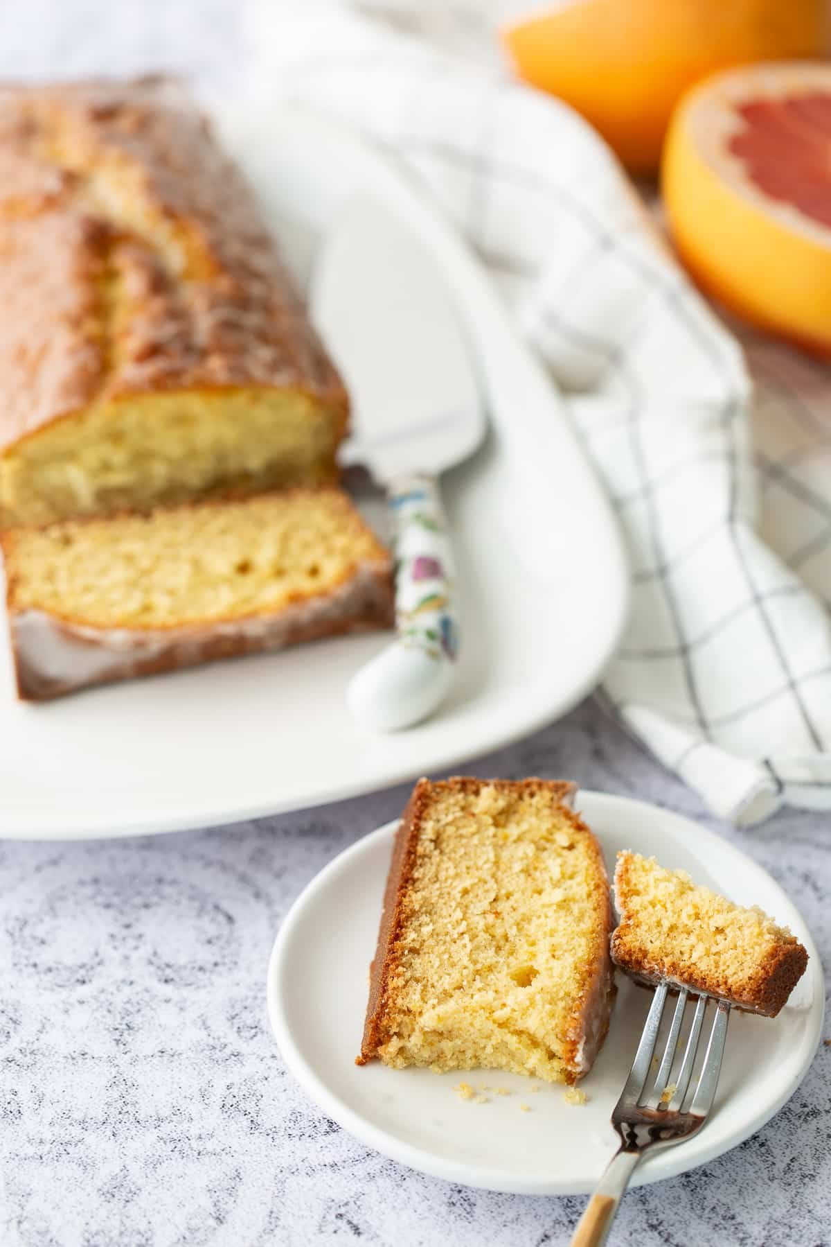 slice of grapefruit cake broken in hald