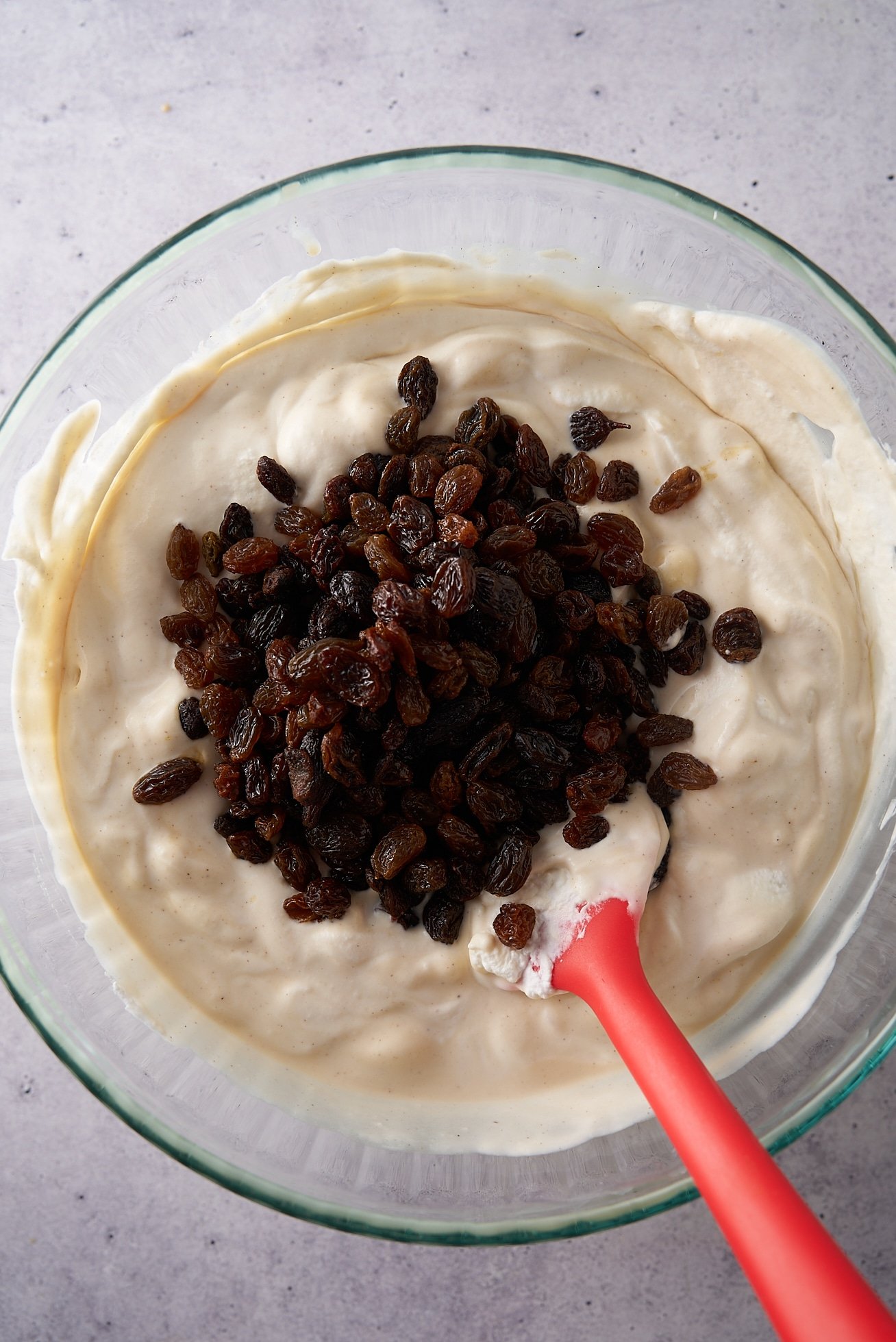rum soaked raisins into light ice cream mixture