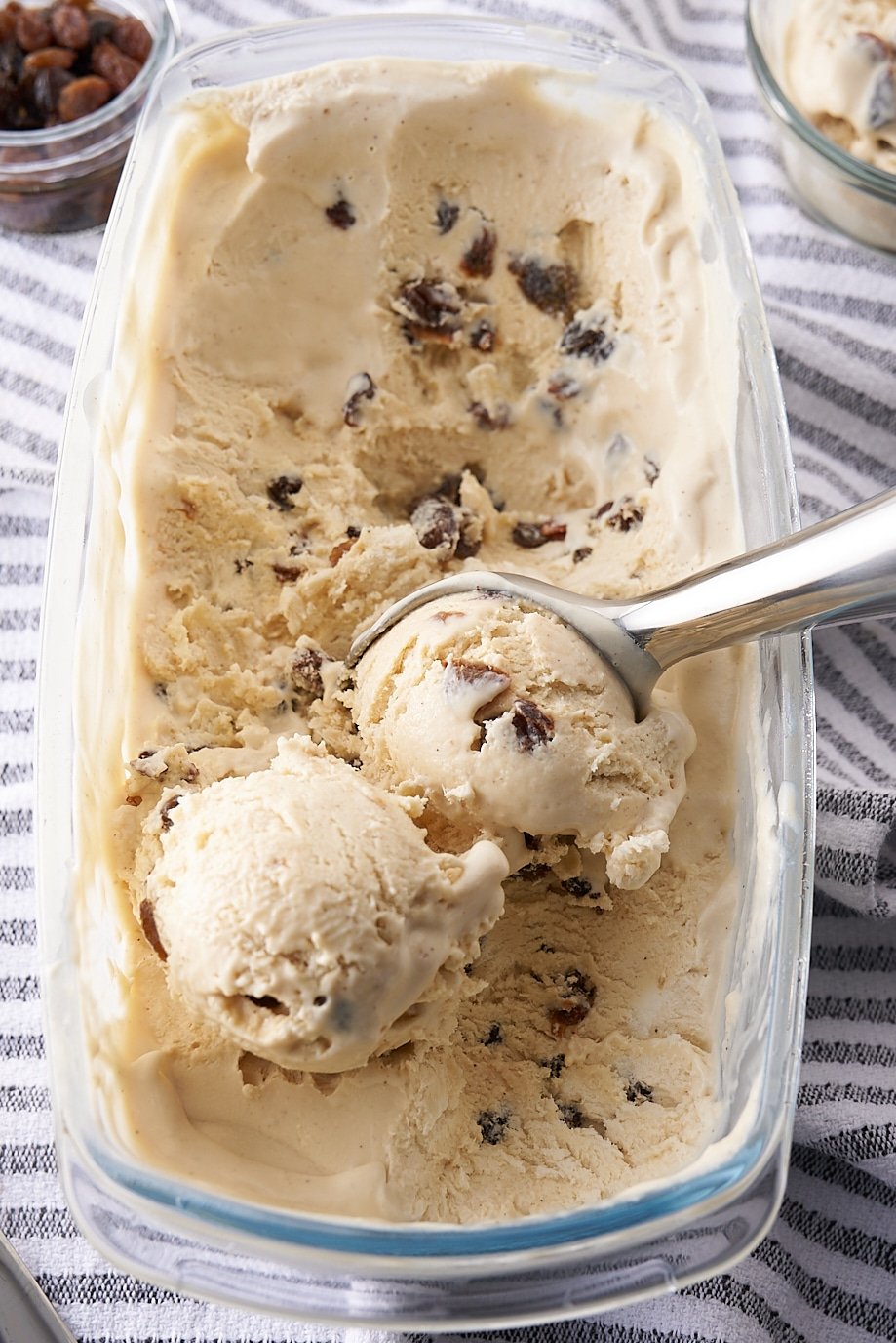rum raisin ice cream being scooped with ice cream scoop