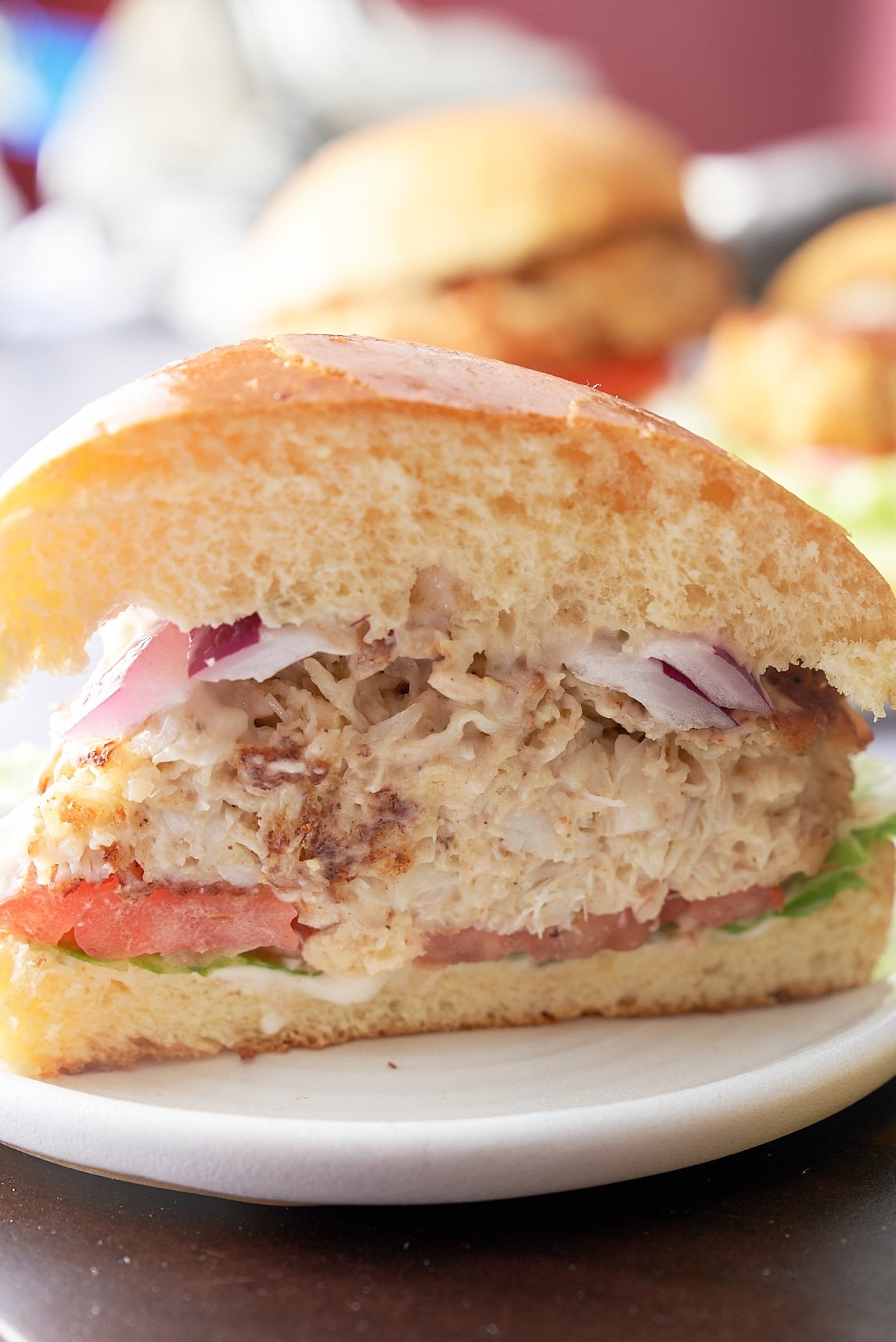 crab cake sandwich cut open to show inside of sandwich