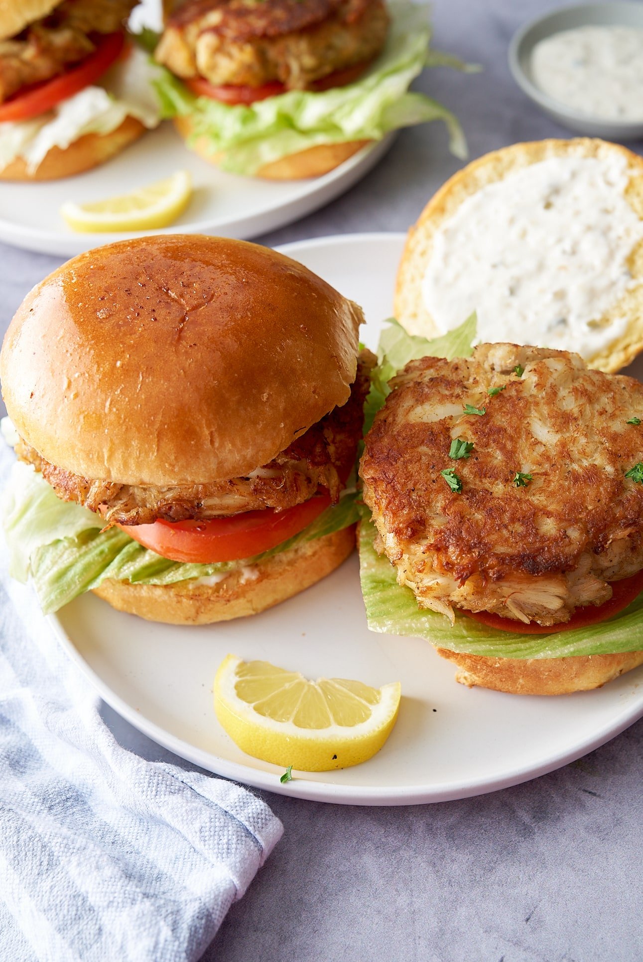 crab cake sandwich with crab cake showing on sandwich