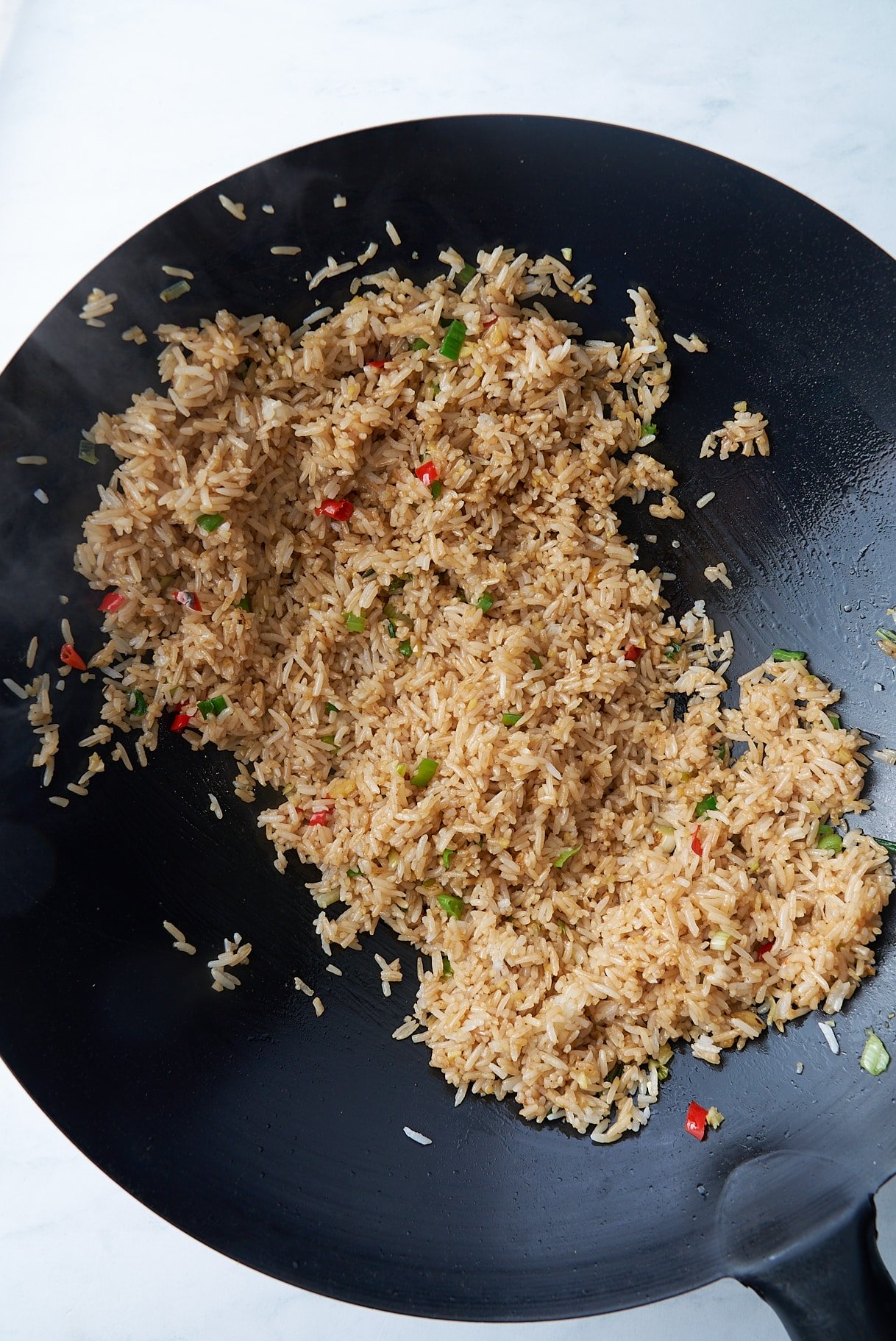 sauces added to rice in skillet