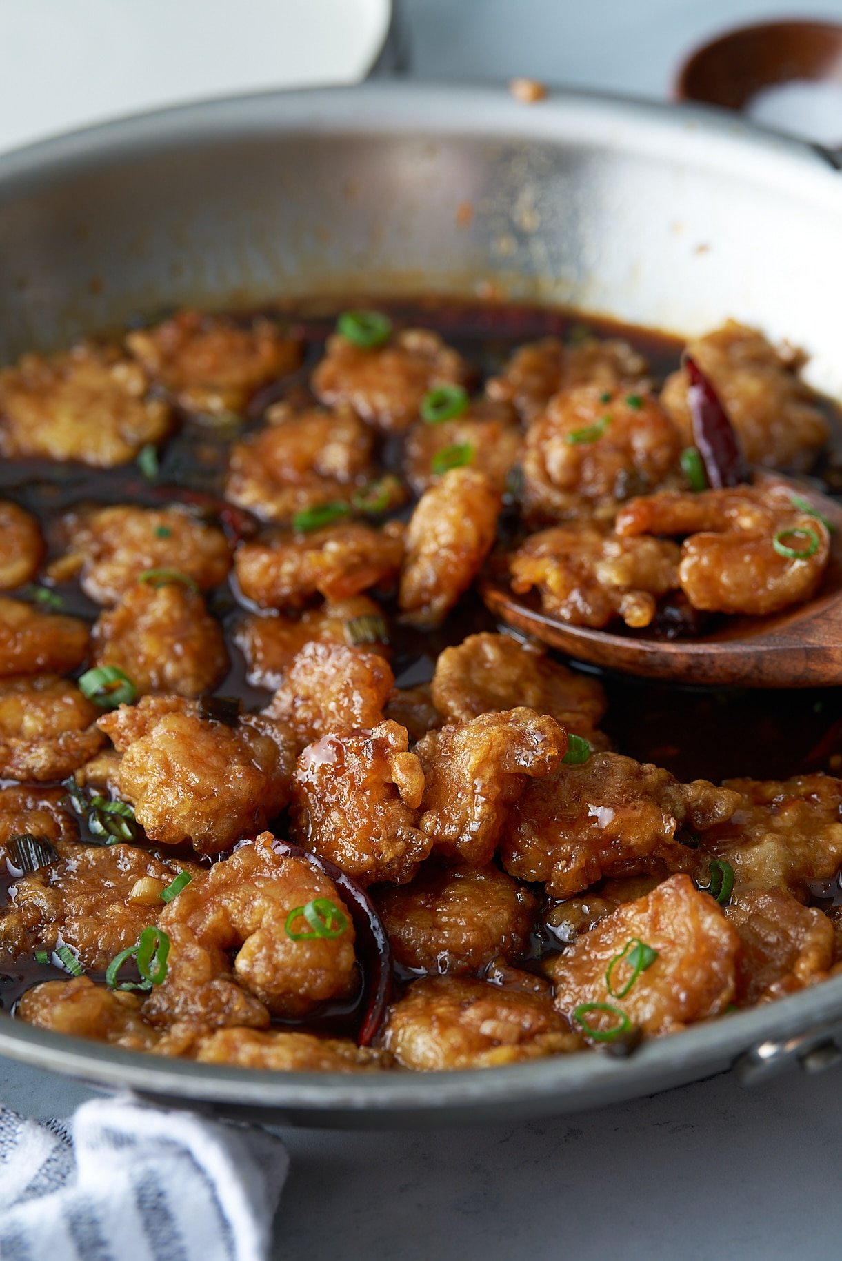 general tso's shrimp with spoon picking it up