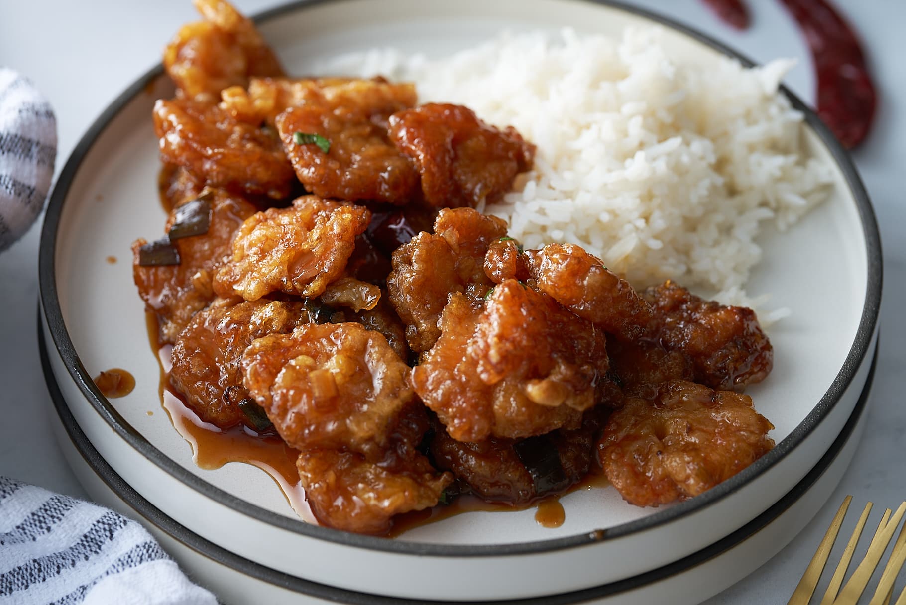 general tso's shrimp on plate with rice