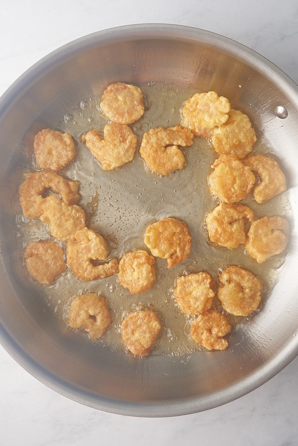 shrimp frying in skillet