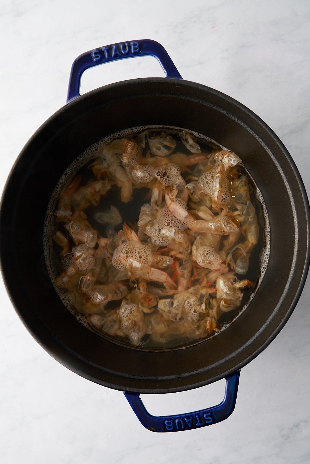water on shrimp shells in pot