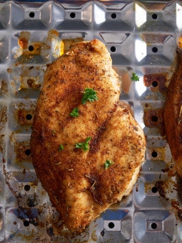 broiled chicken breast on broiler sheet