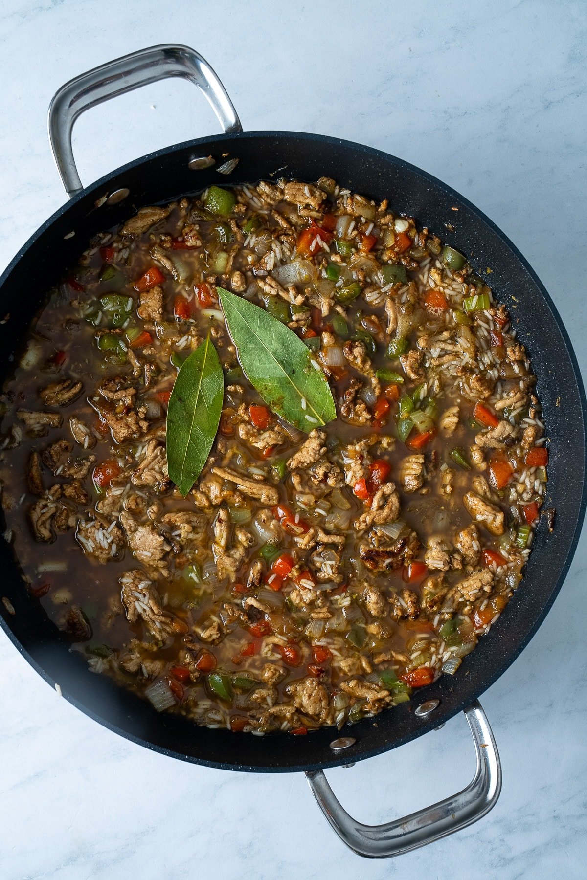 ground chicken and ingredients in pan before cooking