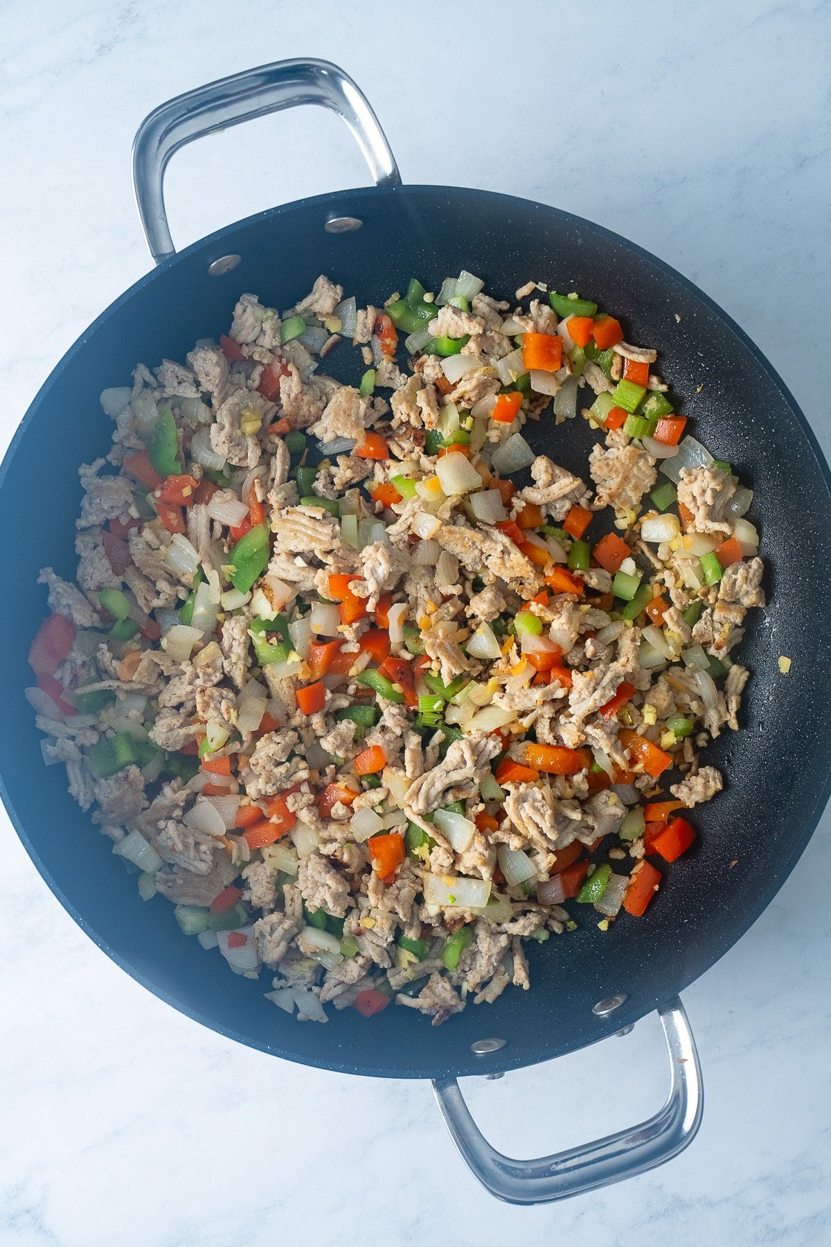 ground chicken and vegetables in pan