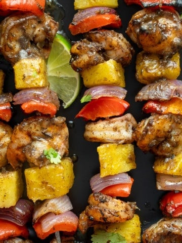 close up photo of jerk skewers