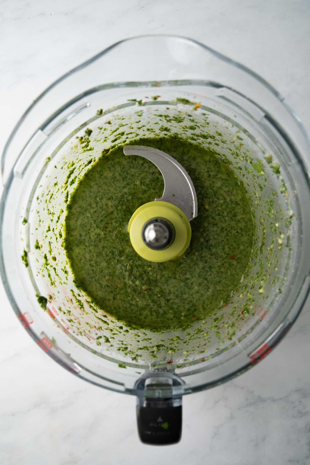 blended chimichurri sauce in food processor bowl