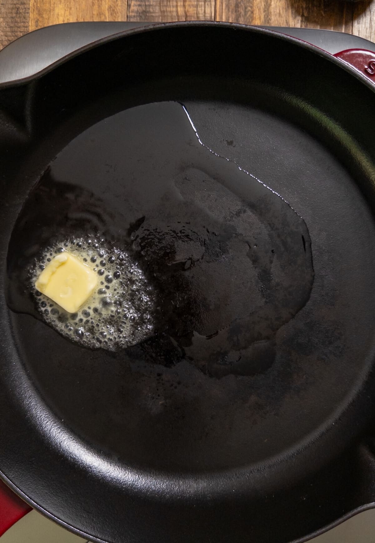 butter and oil heating in cast iron skillet