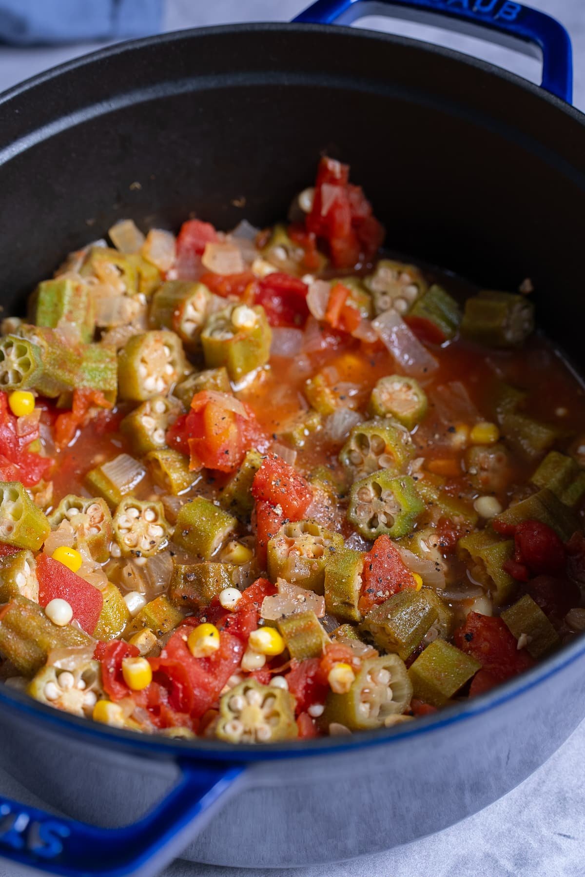 stewed okra and tomatoes in a large pot