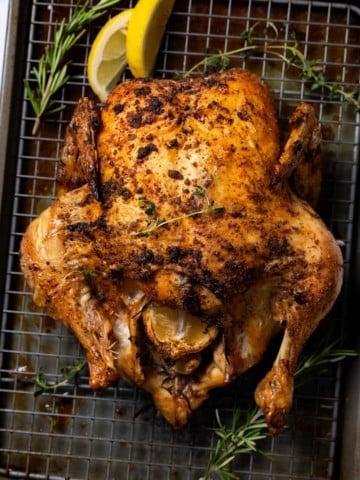 golden brown roast chicken on sheet pan