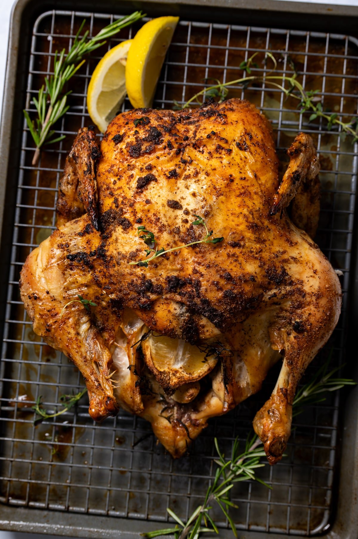 golden brown roast chicken on sheet pan