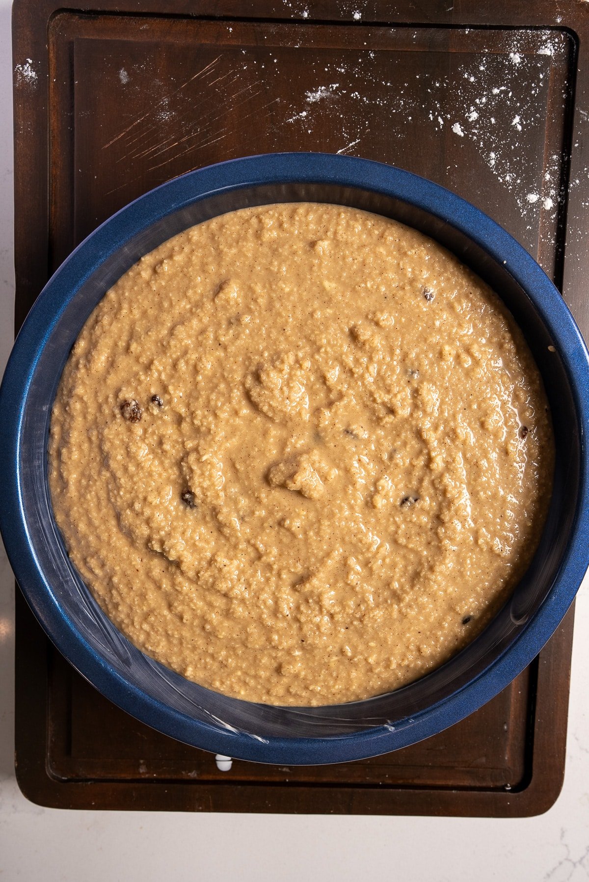 pudding batter in cake pan before baking