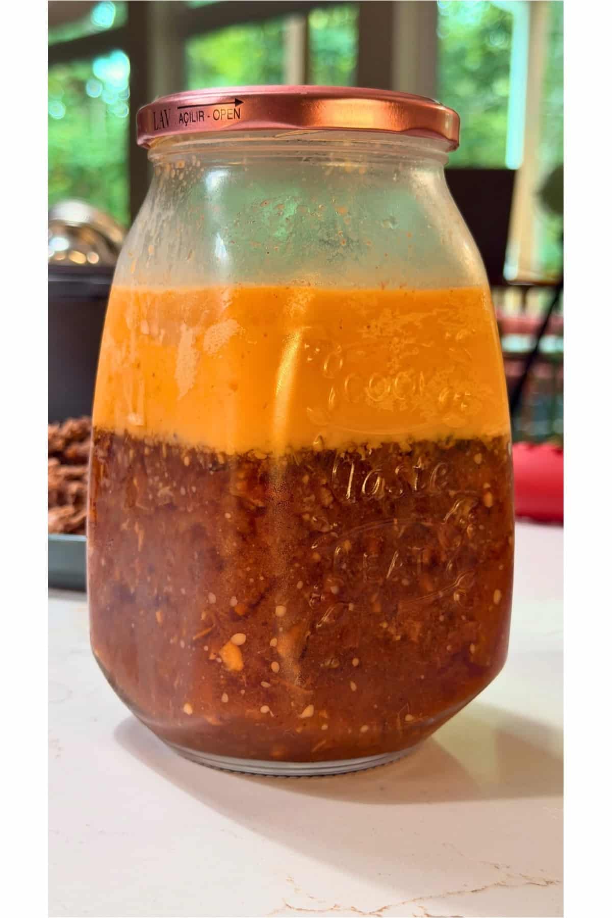 refrigerated fat on top of braising liquid in glass jar