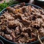 braised lamb on blue plate shredded