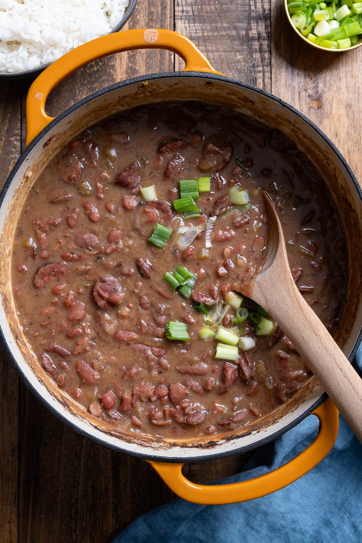 spoon inside pot of red beans and rice