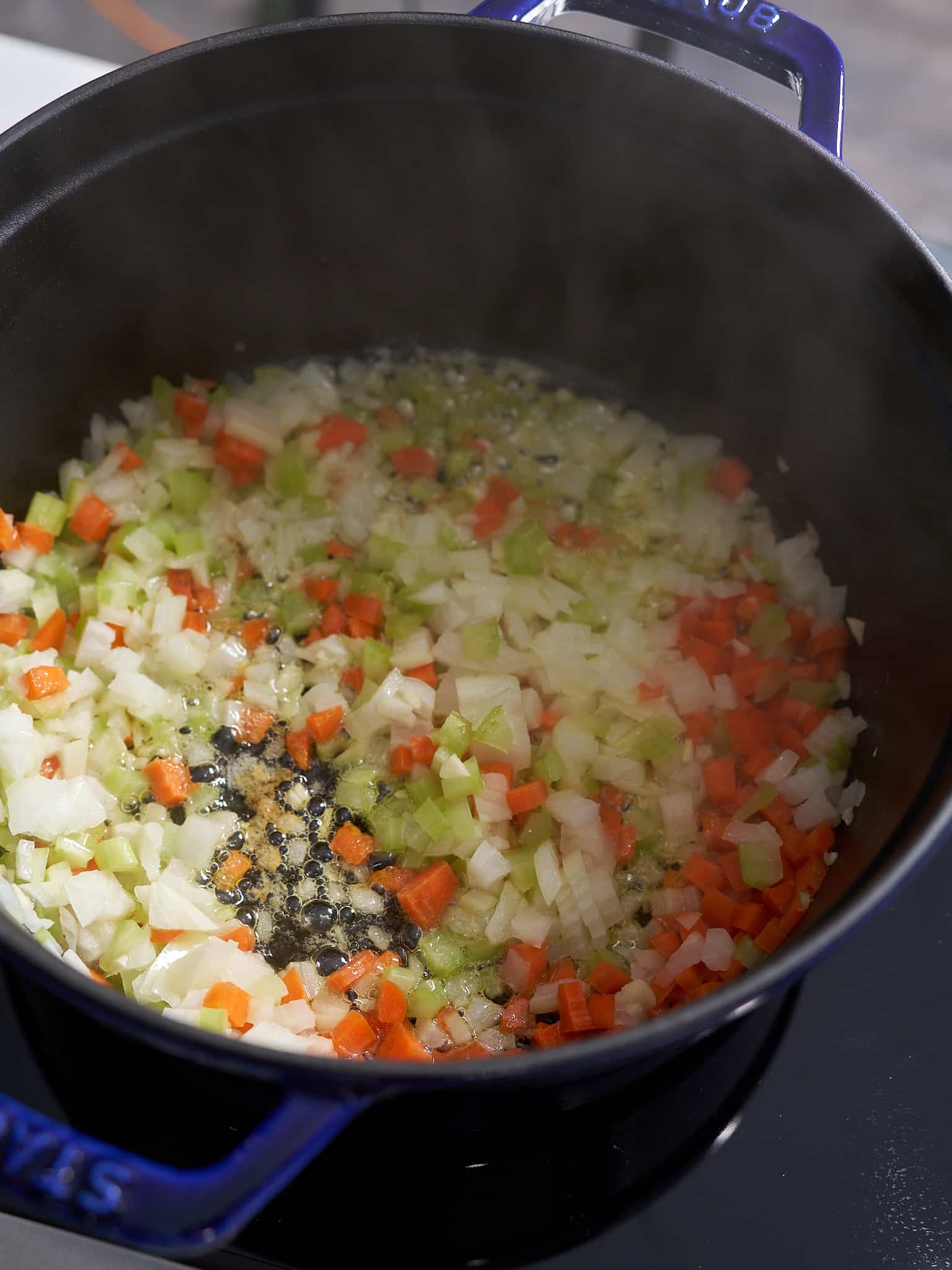 vegetables cooking in butter in pot