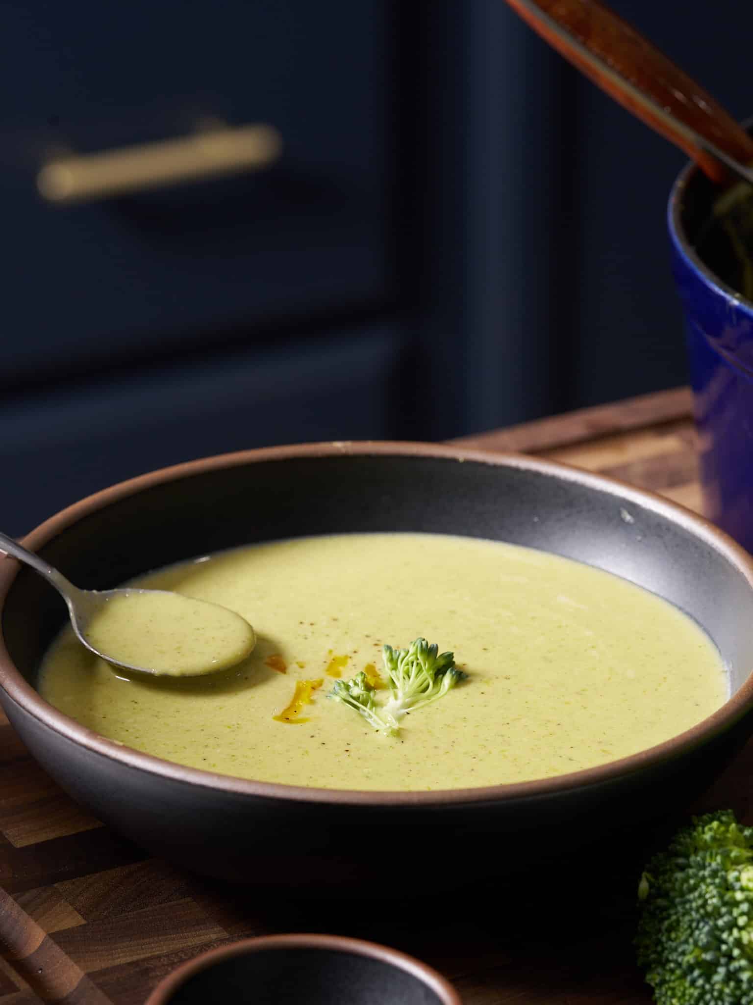 spoon picking up soup from bowl