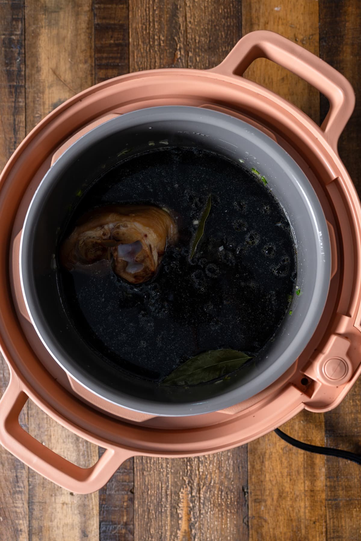 ham hock and beans and liquid in pressure cooker