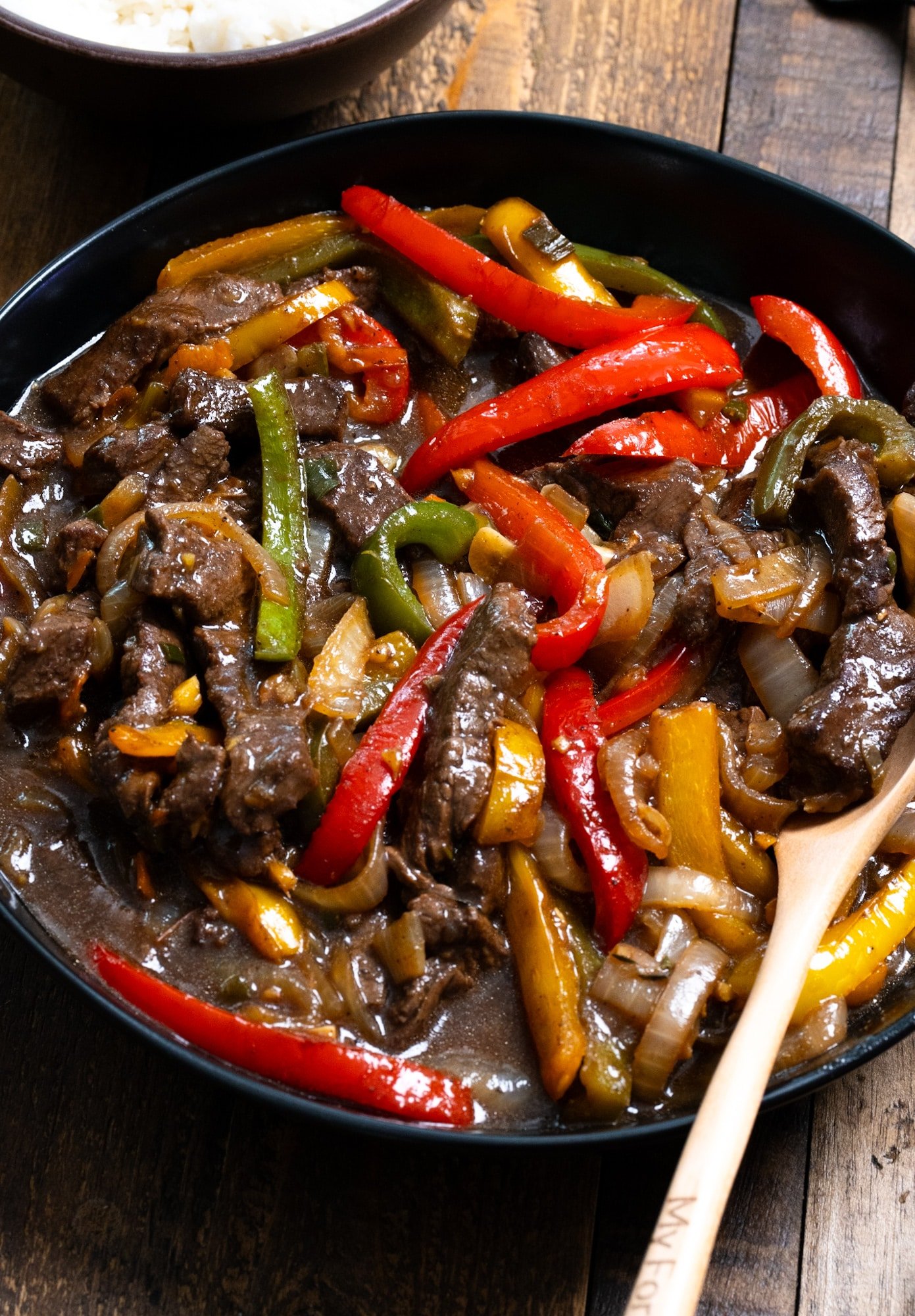 Close-up side image of Jamaican pepper steak in a bowl.