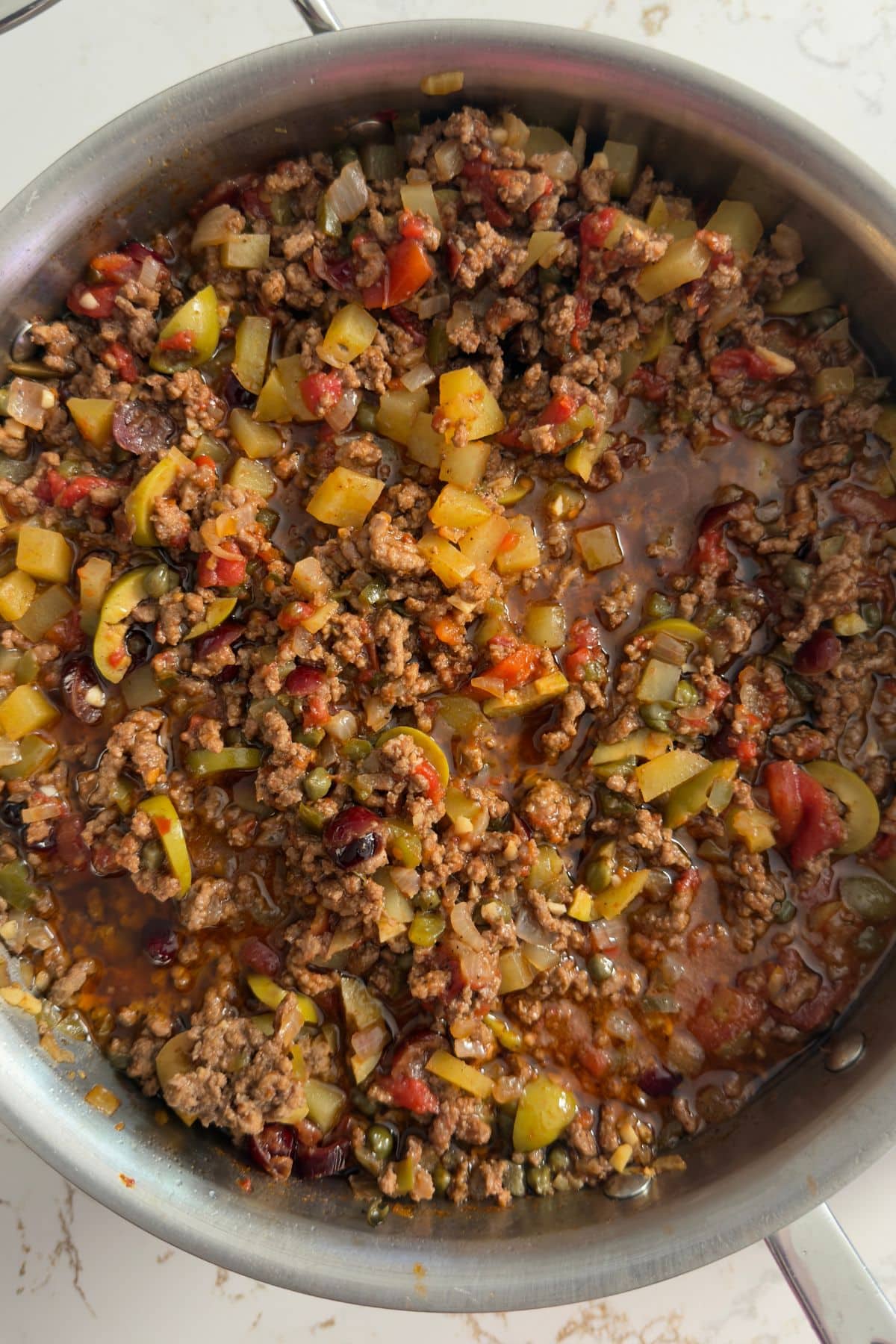 Picadillo and skillet after stewing down
