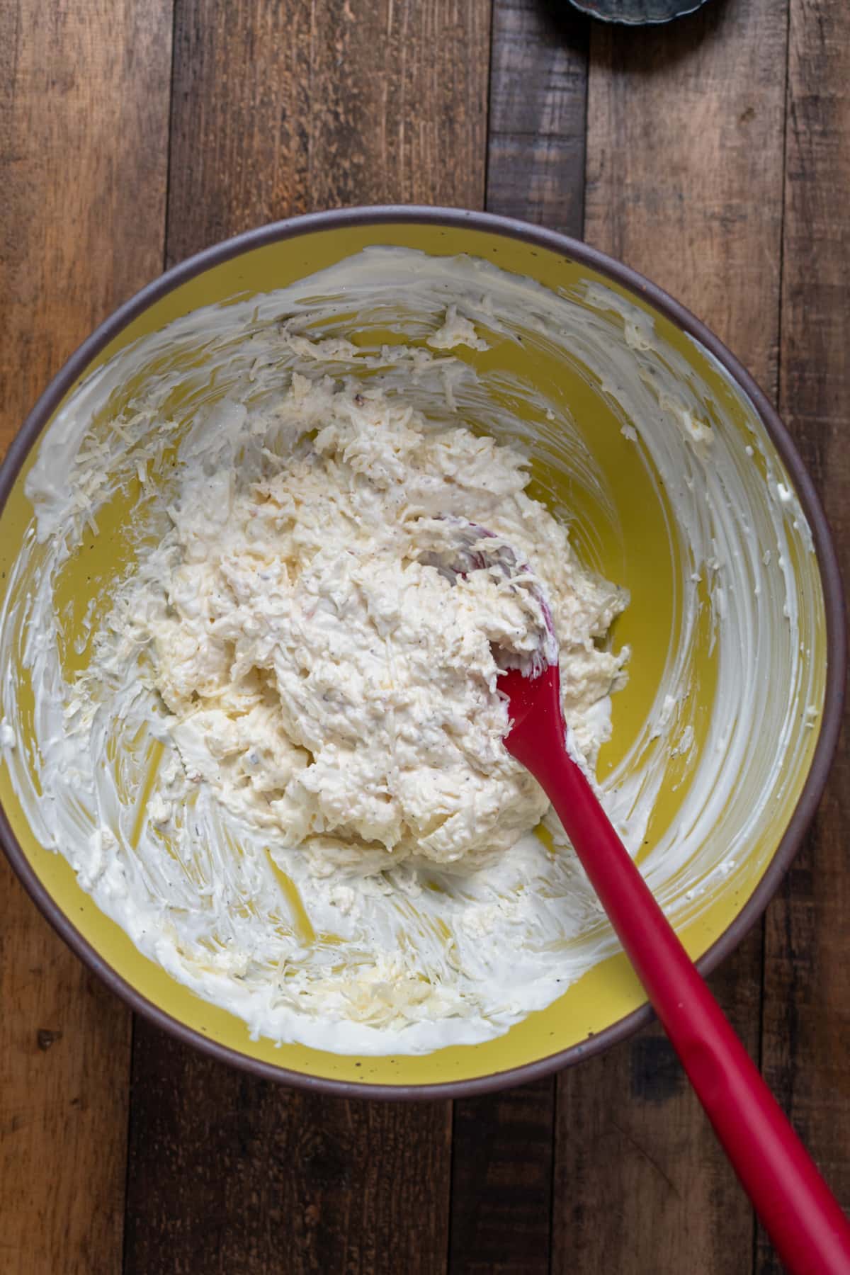 cheeses mixed in yellow bowl