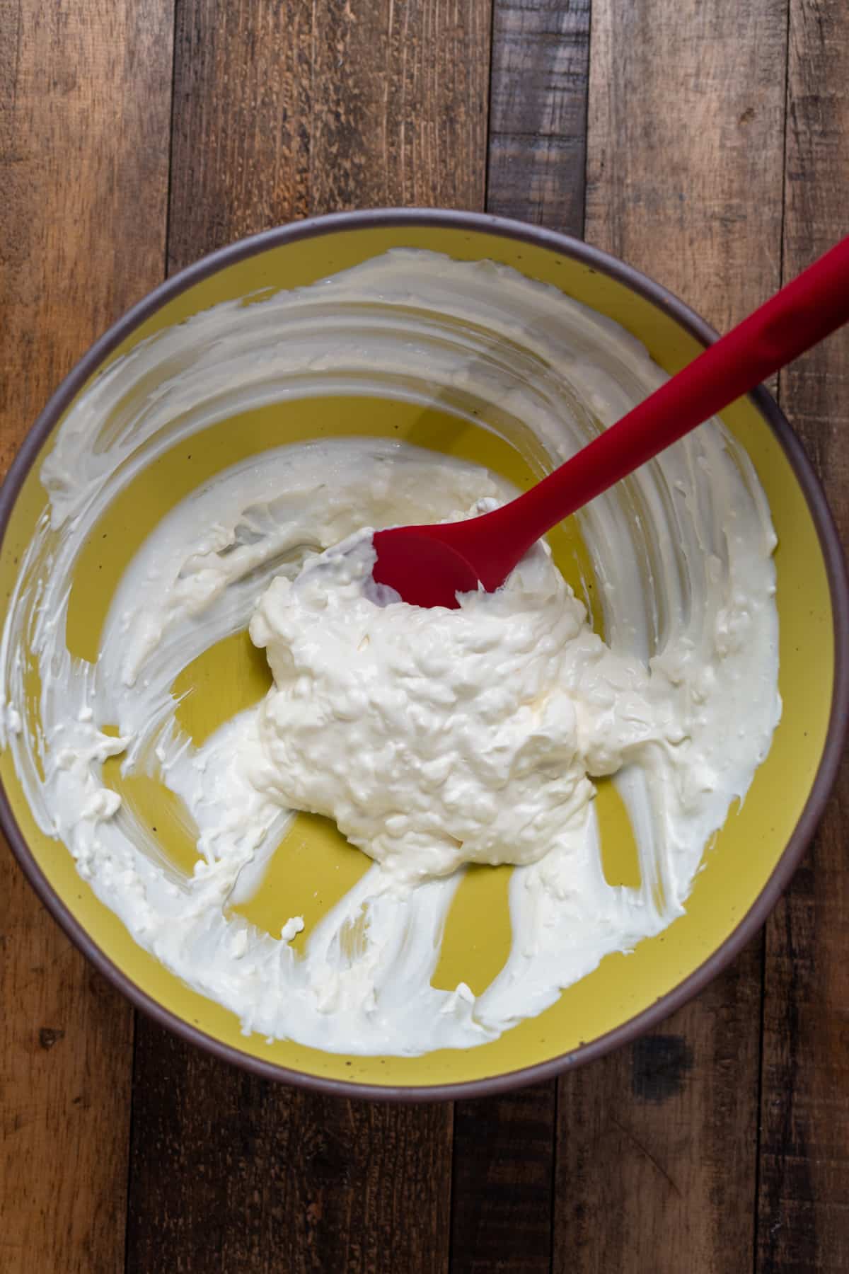 cheeses mixed in yellow bowl