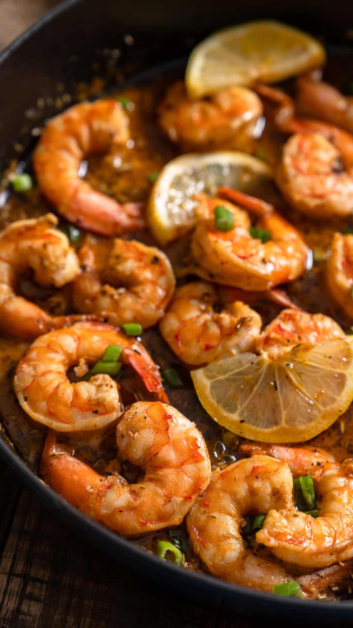 close up photo of BBQ shrimp in skillet