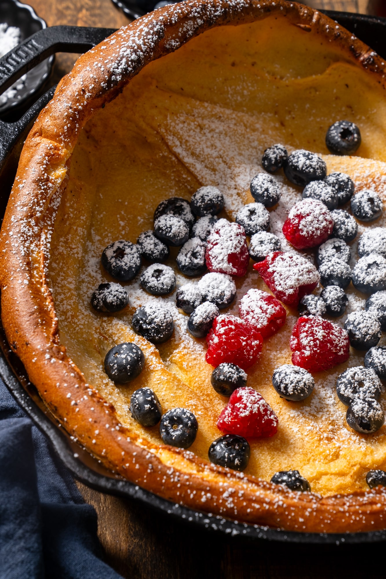 Close-up photo of Dutch baby pancake from above.