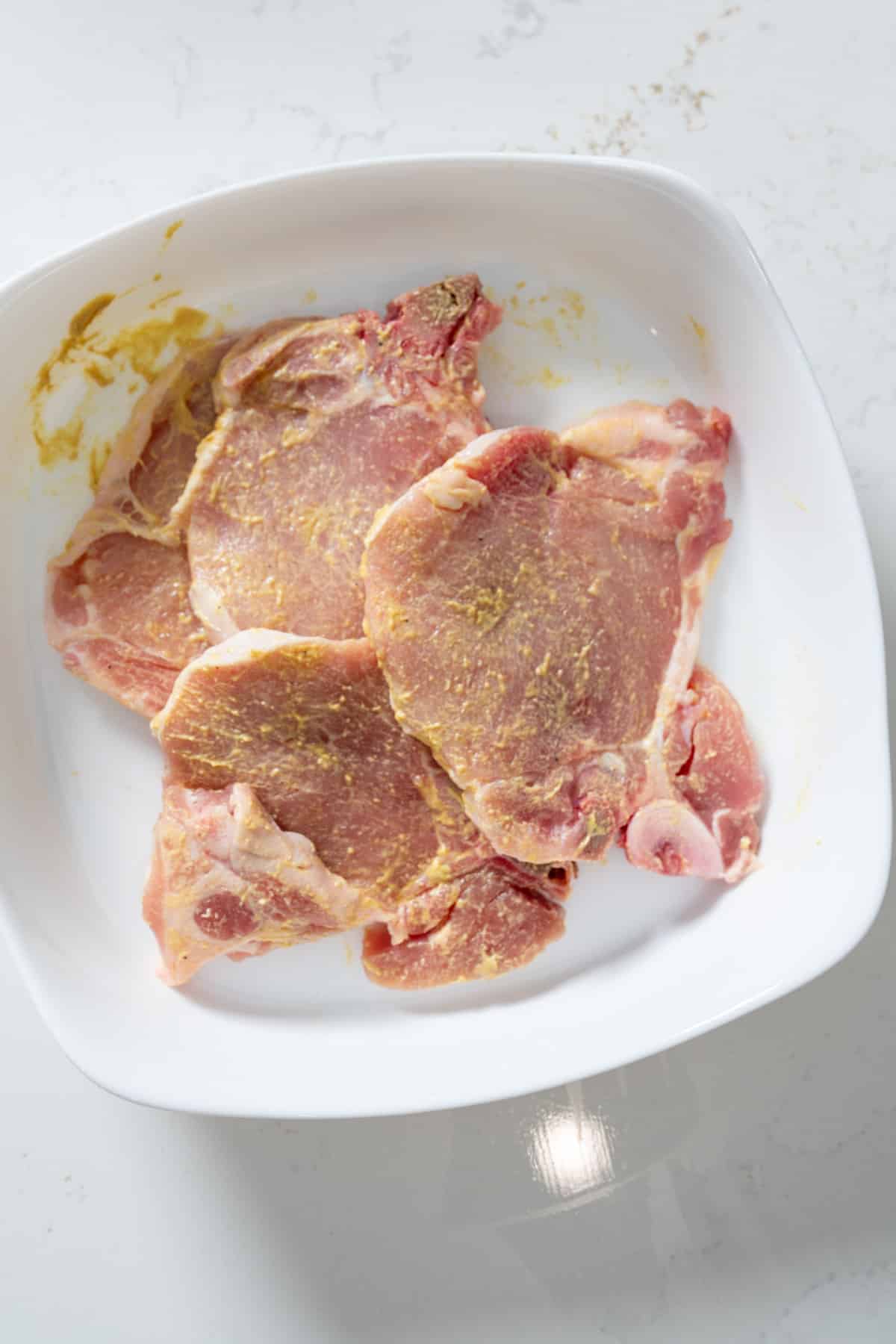 pork chops covered in mustard