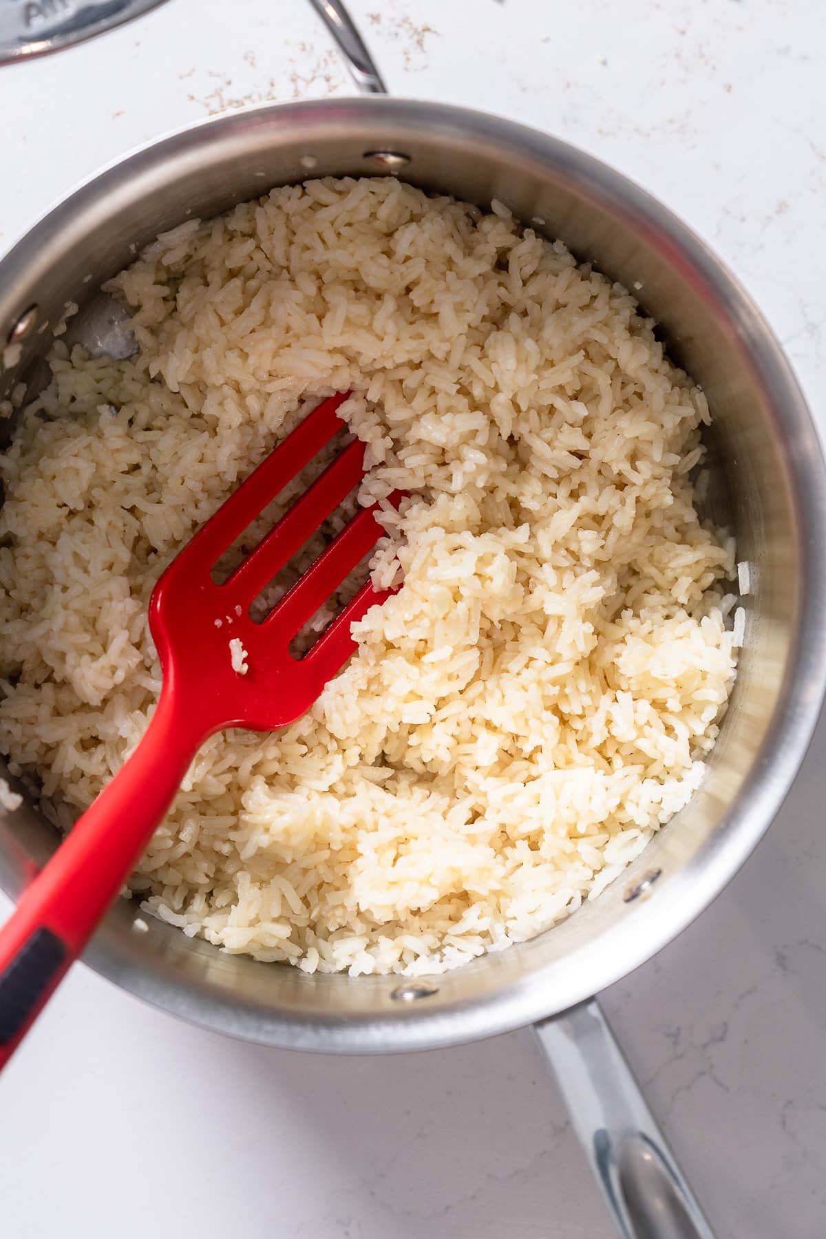 cooked garlic butter rice after being fluffed with fork