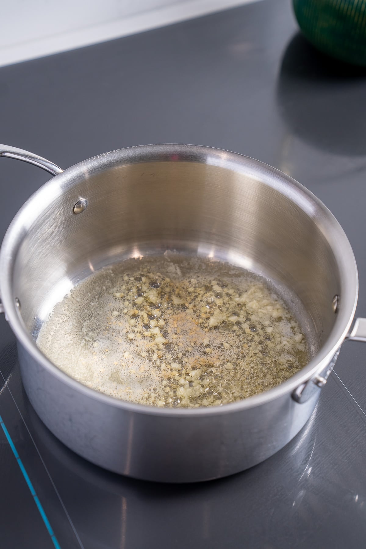 garlic sweating in butter in pot